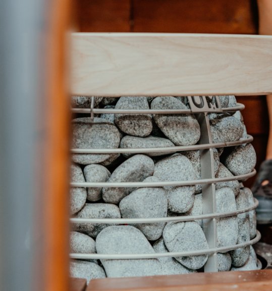 HUUM HIVE Mini sauna heater, stone-clad sculptural design