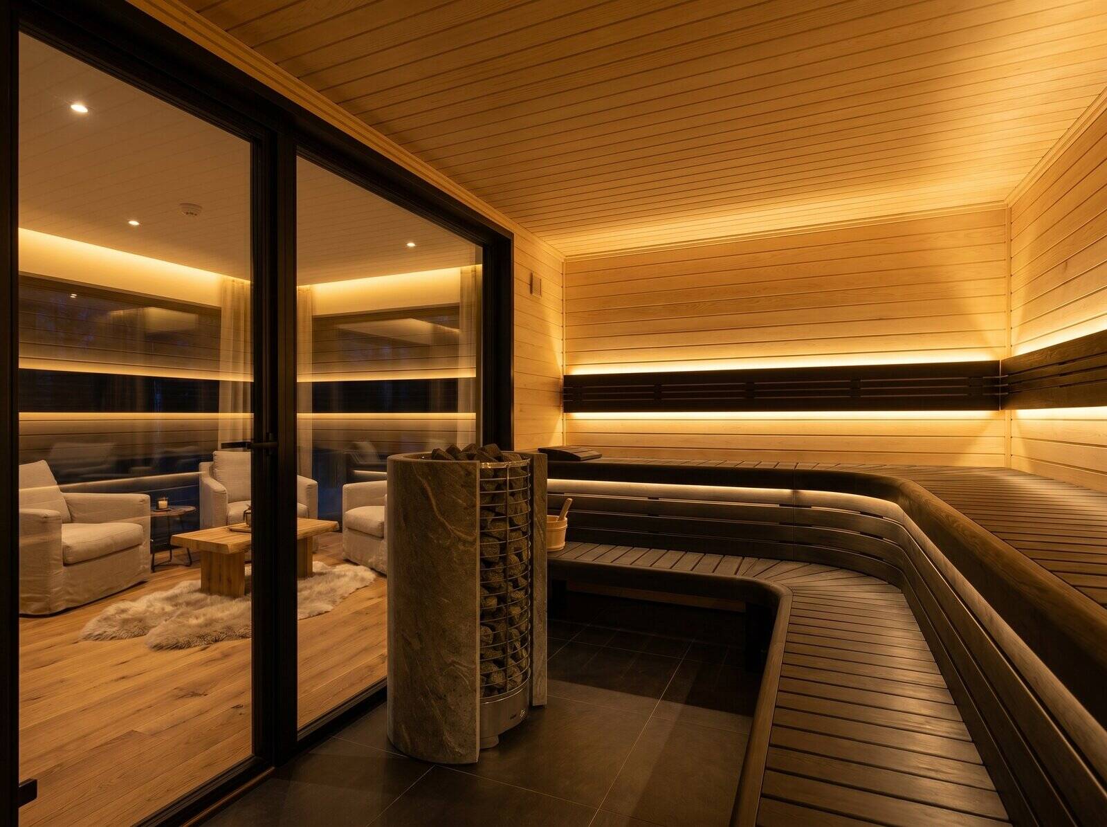 SAGA interior — panoramic sauna and finished relax room